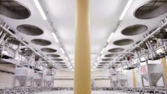 Daxner FTS Container transport system IBC handling system with cover-manipulator collects the dosed and weighed components