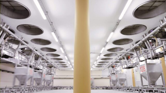 Daxner FTS Container transport system IBC handling system with cover-manipulator collects the dosed and weighed components